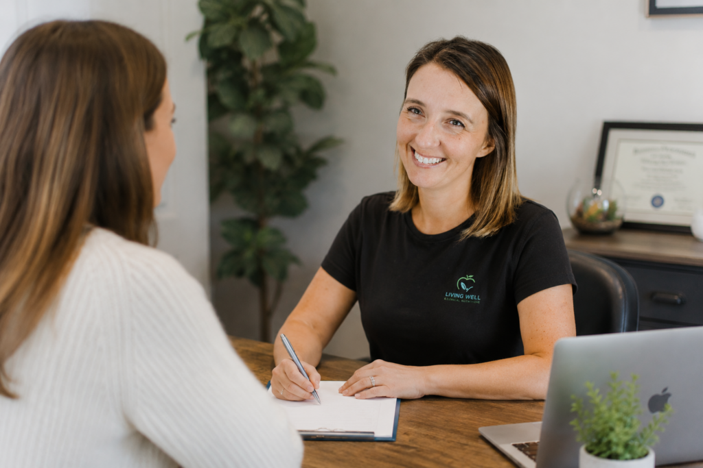 Practitioner meeting with a patient for a personalized holistic wellness consultation in League City, TX